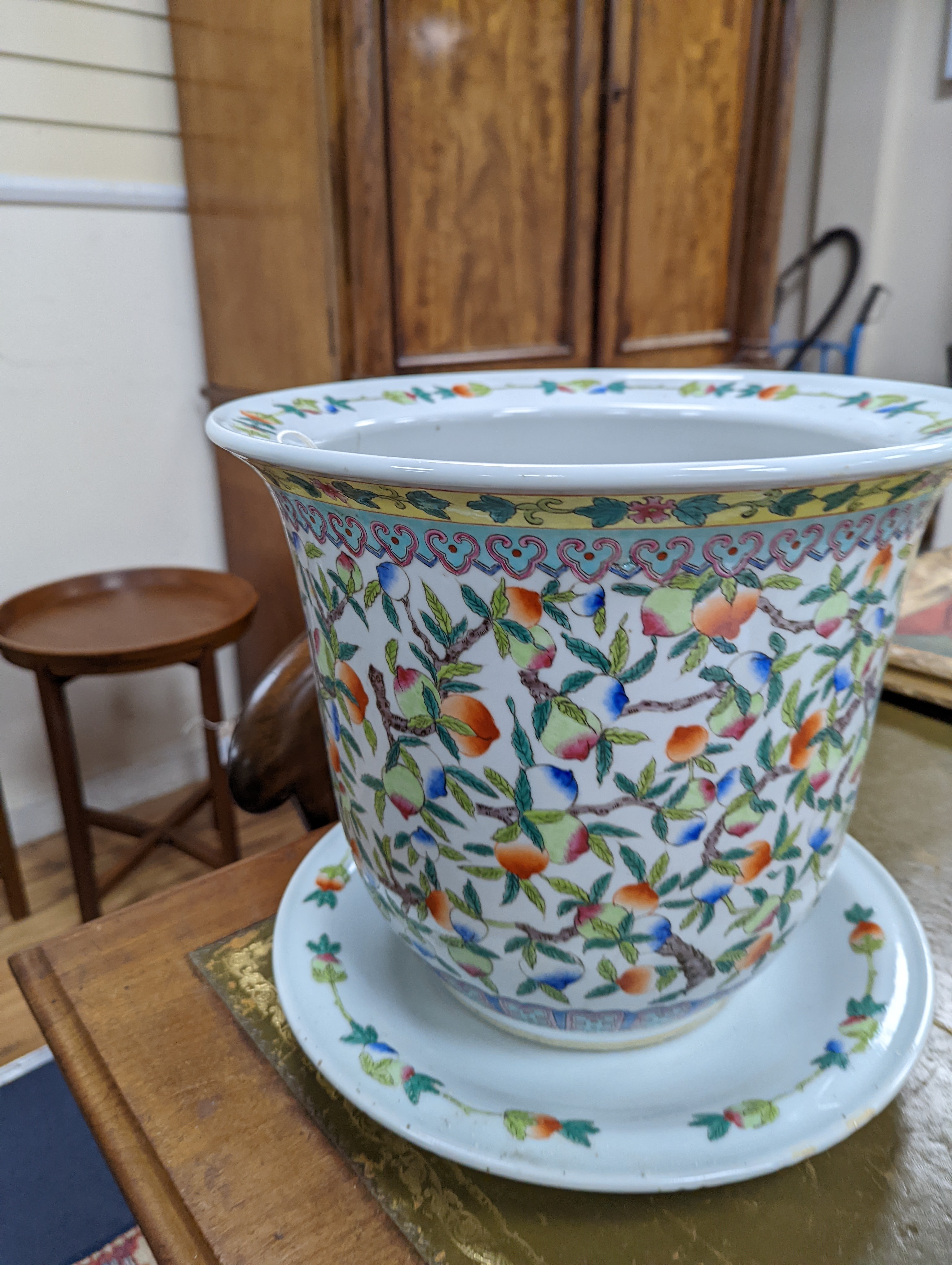 A 20th century Chinese porcelain jardiniere and dish, diameter 36 cms.